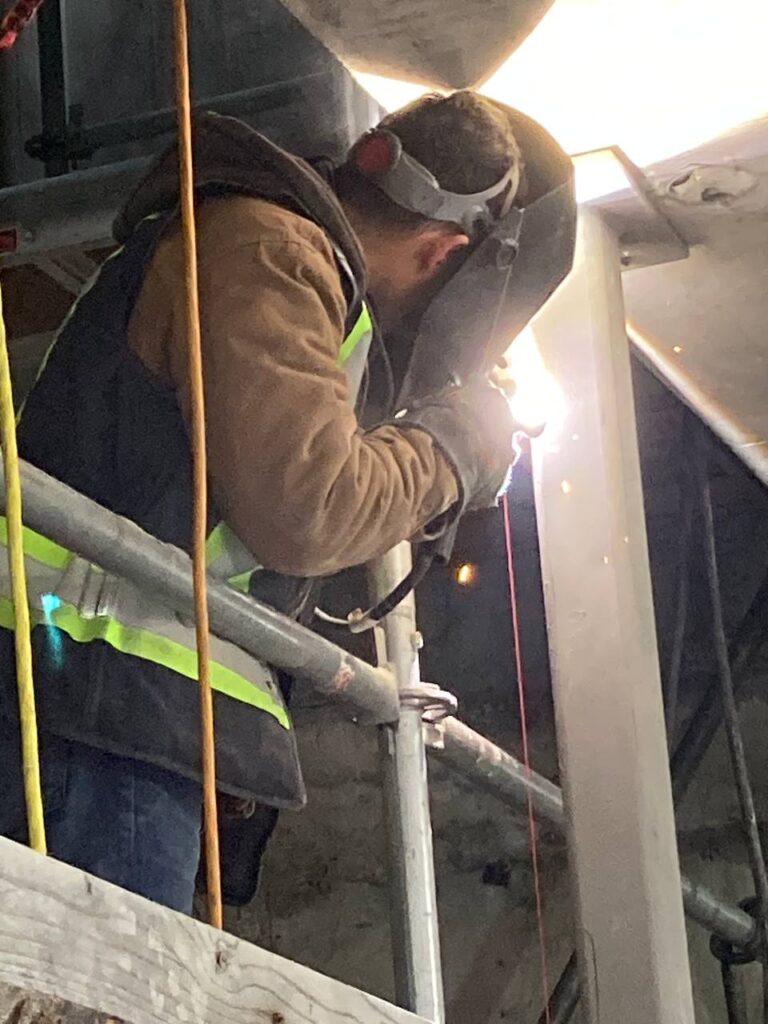 Final Steel Beam Installation for Building at 8486 Oak Street, Vancouver