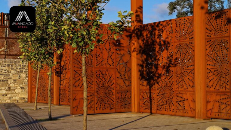 External view of decorative pre-rusted perforated steel fence surrounding the Port Centre in Dublin, Ireland. Trees in the foreground. Sunny day.