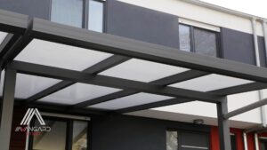 Custom steel rain canopy over a Vancouver entry with integrated gutter and powder coated finish
