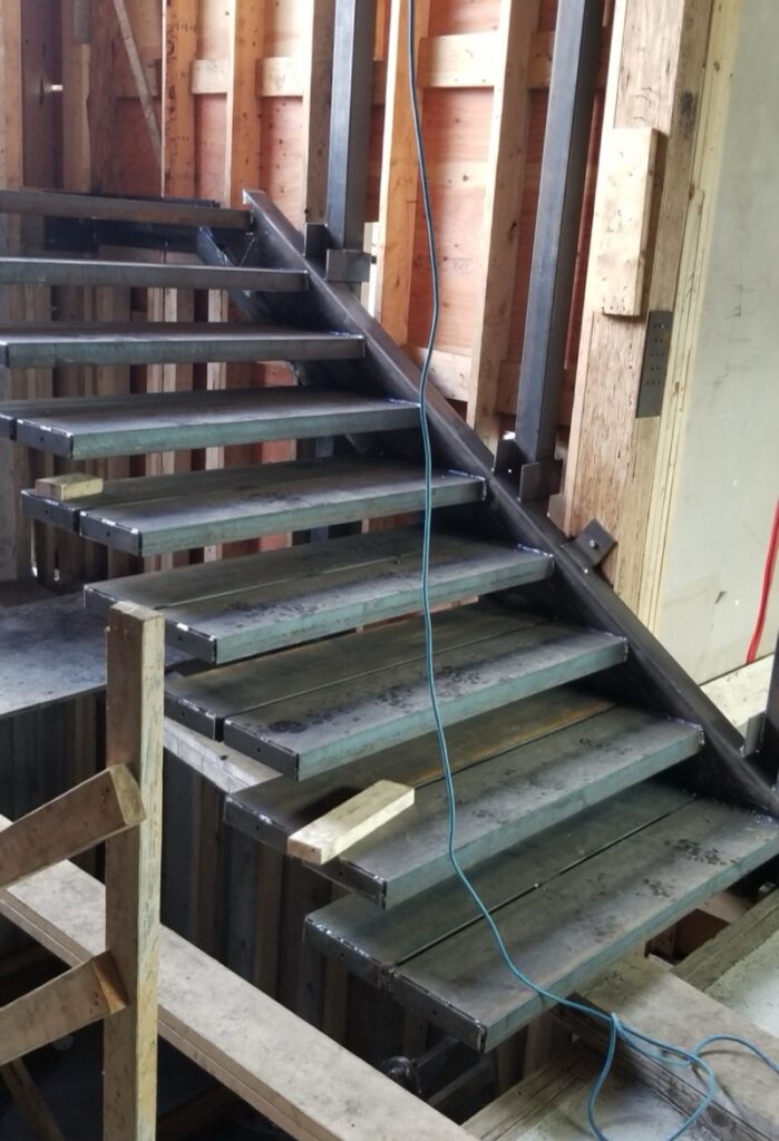 Side view of custom steel stairs at 690 Knockmaroon Rd., West Vancouver