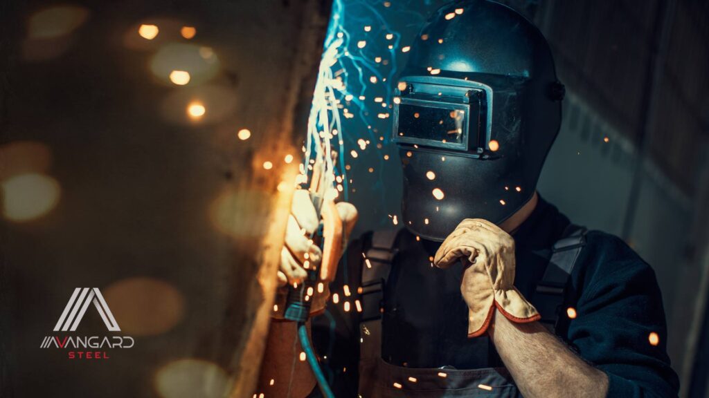 Certified welder performing custom metal welding inside a Vancouver BC workshop for Avangard Steel