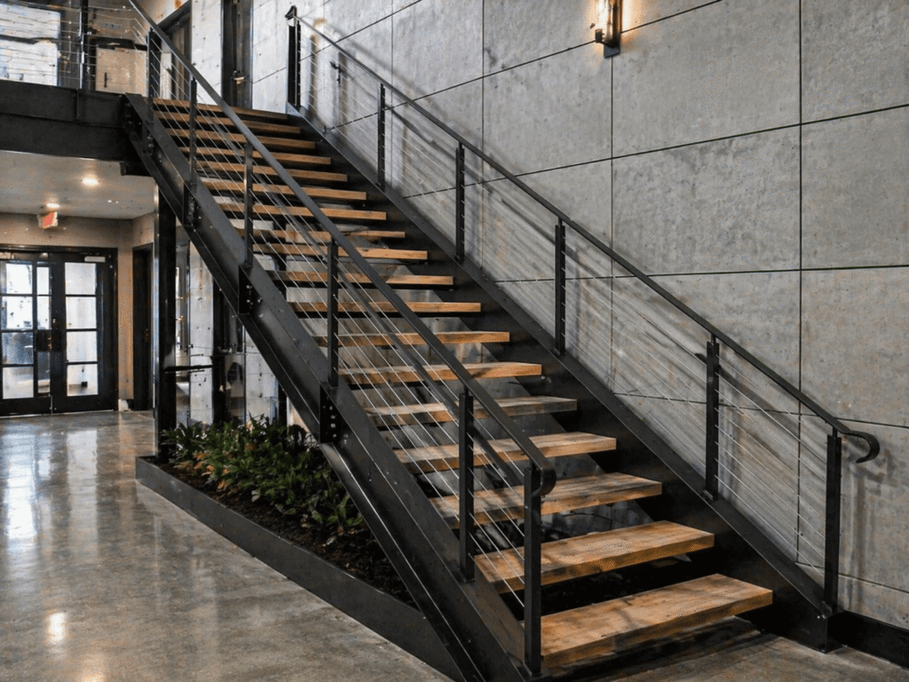 Double stringer steel stairs feature two structural steel beams on each side of the staircase for extra support and durability.