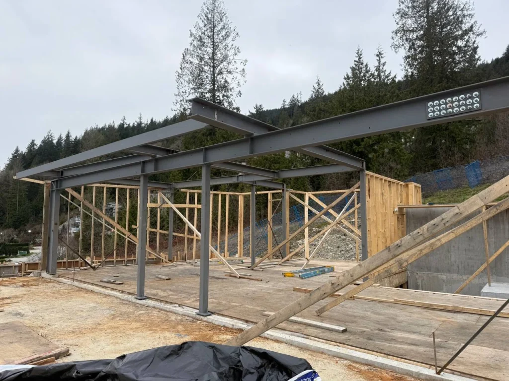 Structural steel beams and columns installed for modern custom home project